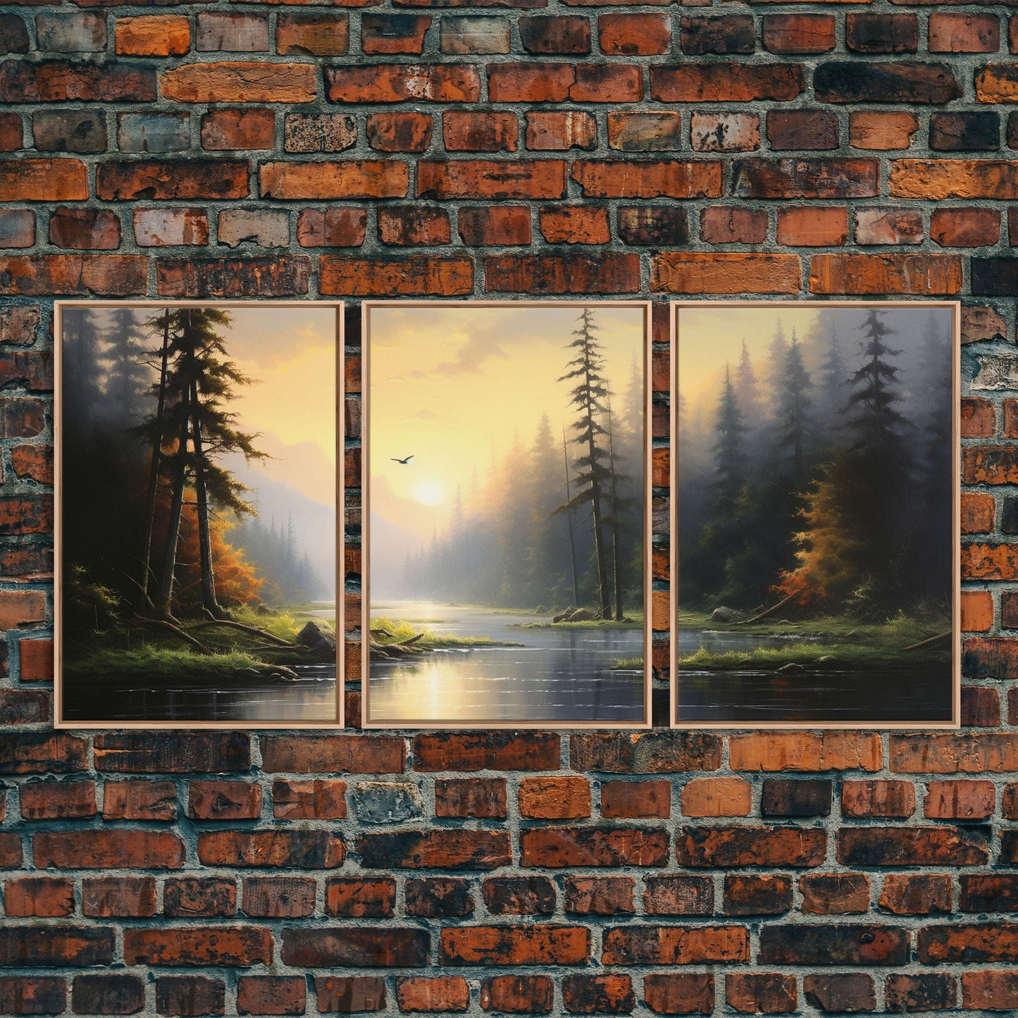 Three framed paintings of a forest scene with a lake on a brick wall.