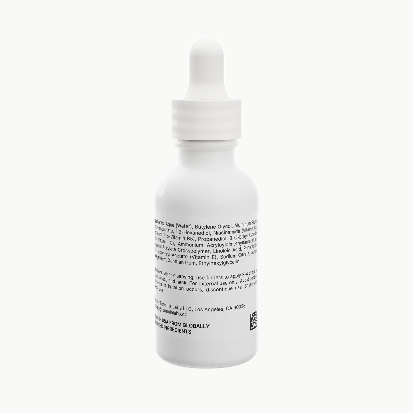White dropper bottle with label on a white background