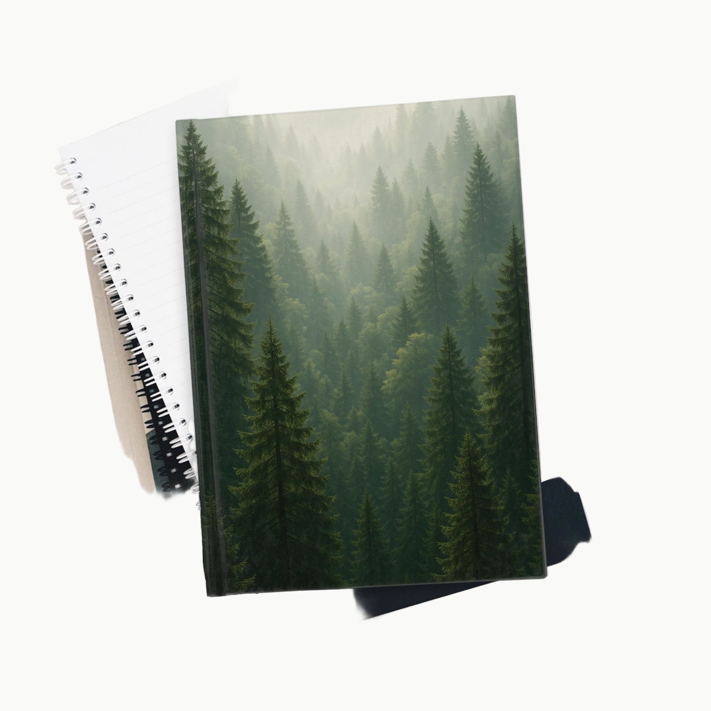 Notebook with a forest cover on a white background