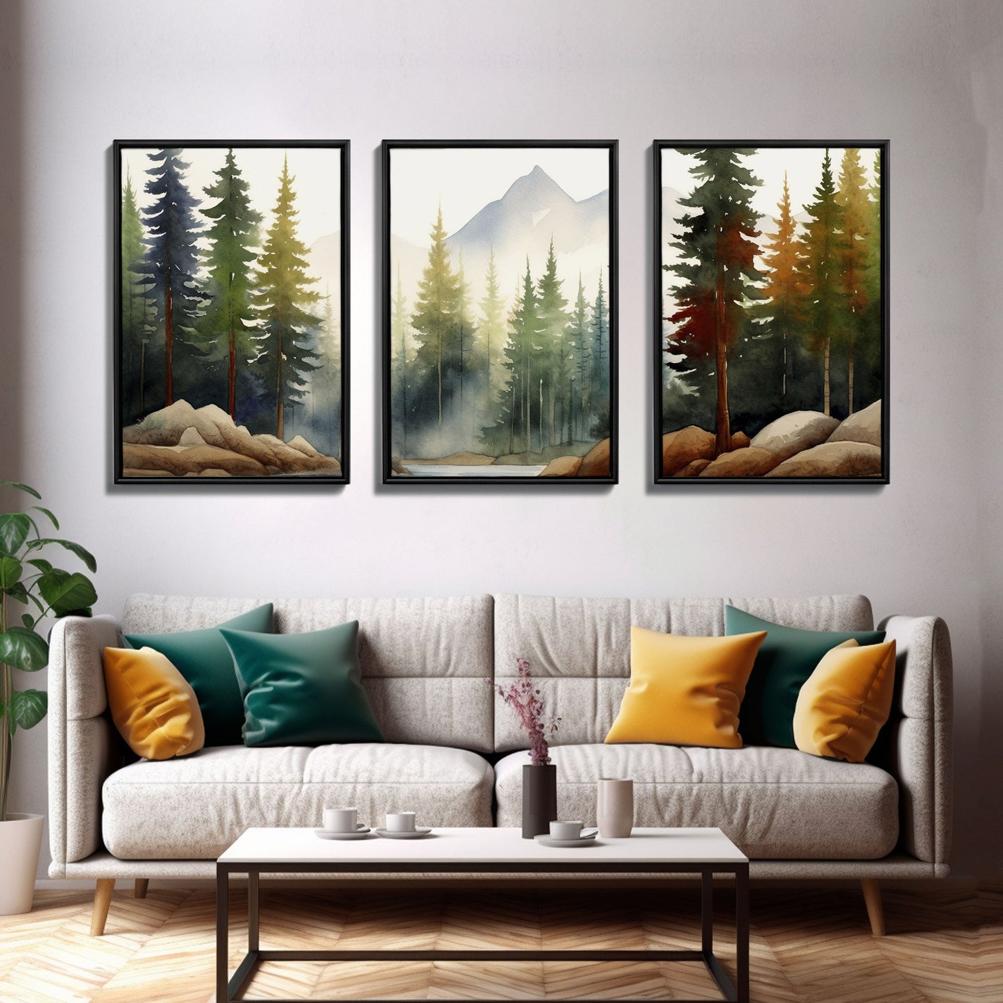 Three framed nature prints above a sofa with colorful cushions in a living room setting.