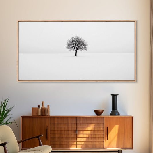 Footprints in the Snow Leading to a Lone Tree | Black & White Framed Canvas Print