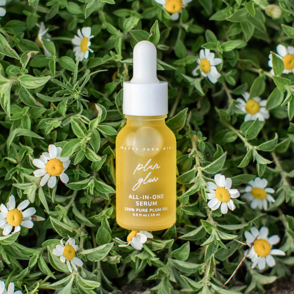 Plum Glow Multipurpose Face Serum face serum with nature-inspired artwork