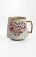 Heart Explosion ceramic mug with nature-inspired artwork