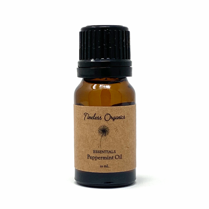 Bottle of Timeless Organics peppermint oil on a white background