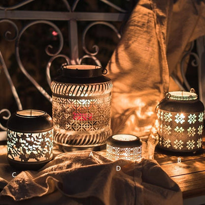 Decorative lanterns with intricate designs on a wooden surface.
