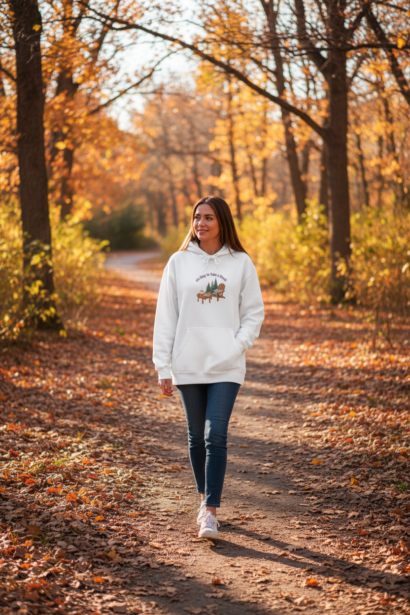 Person in hoodie walking in nature